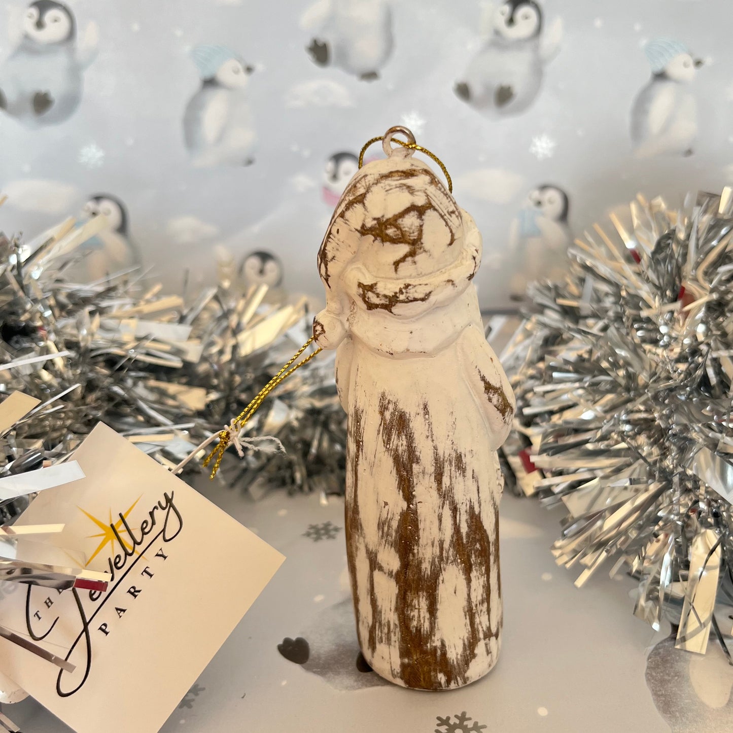 Natural Distressed Effect Carved Santa hanging ornament holding a festive wreath