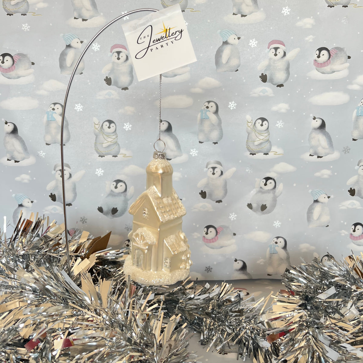 shimmering champagne glass church Christmas ornament accented with sparkling glitter snow details
