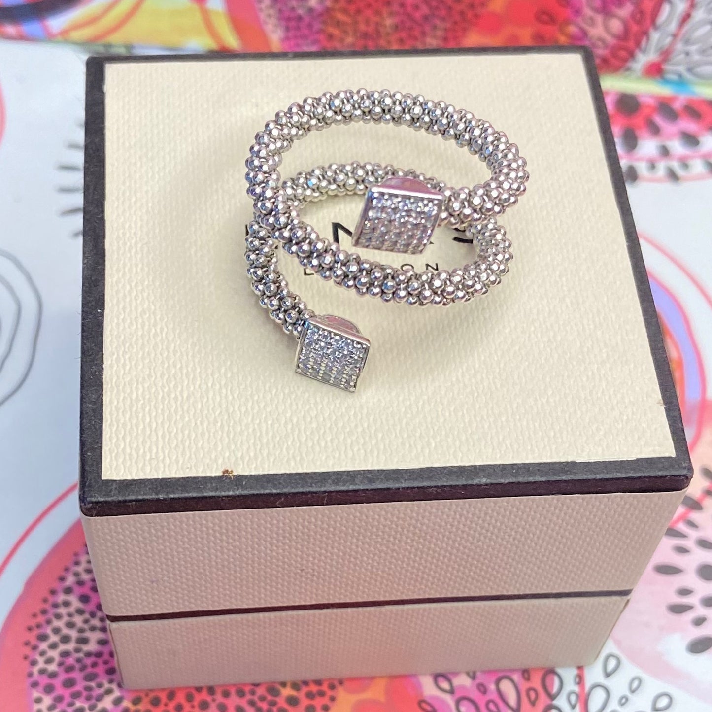 Links of London Sterling Silver Star Dust Wrap Ring with square barrels covered with Sparkly stones.