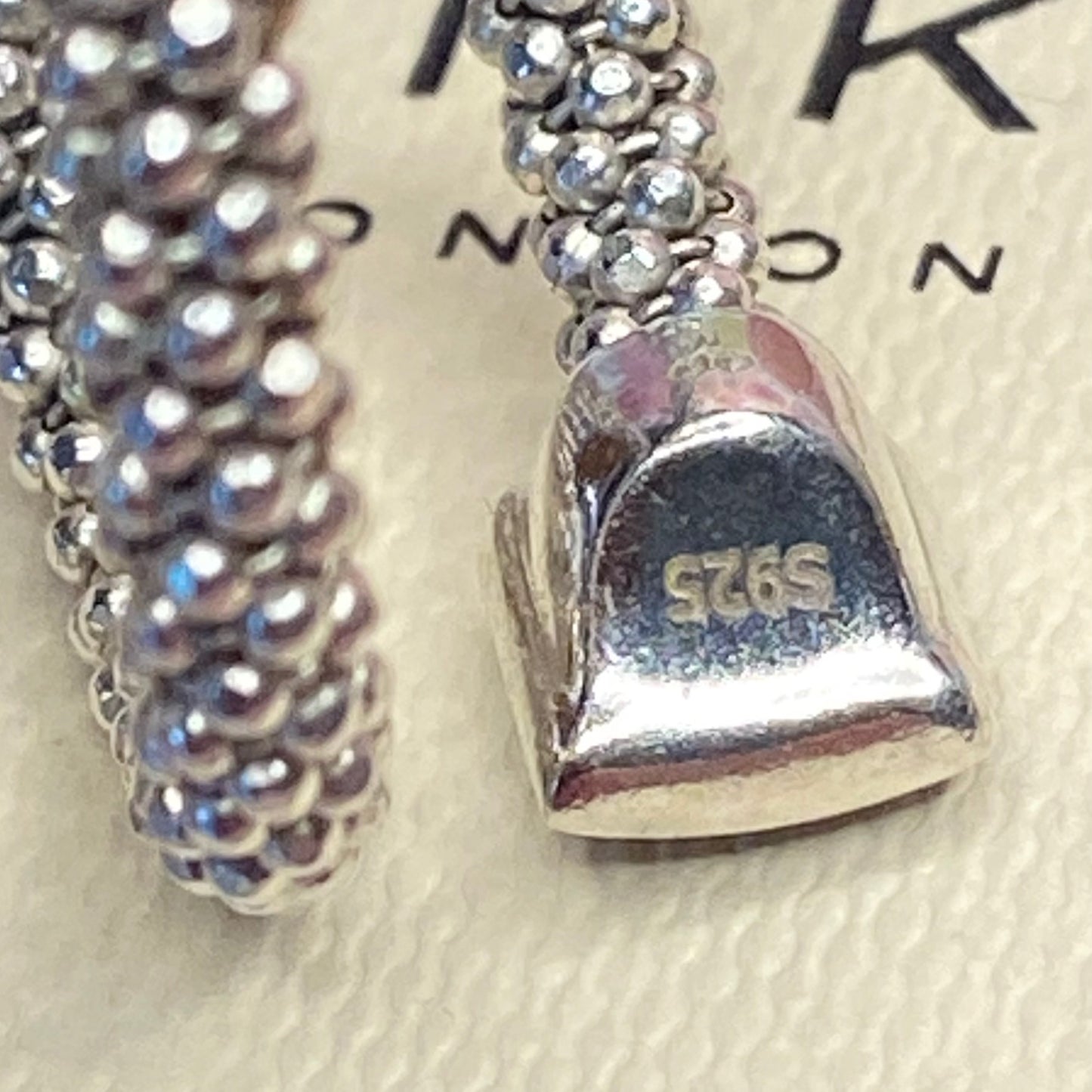 Links of London Sterling Silver Star Dust Wrap Ring with square barrels covered with Sparkly stones.