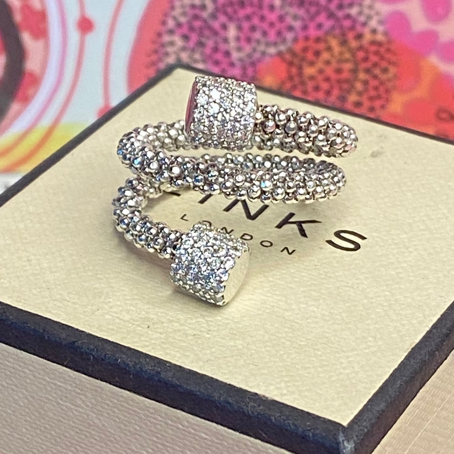 Links of London Sterling Silver Star Dust Wrap Ring with Round barrels covered with Sparkly stones.