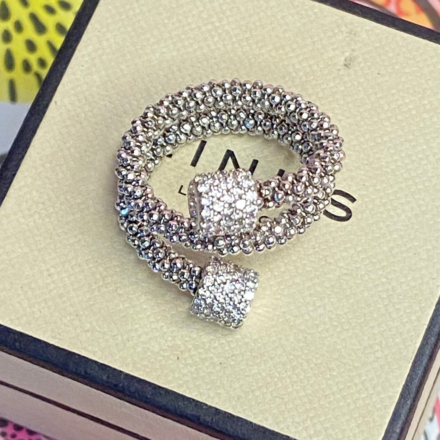 Links of London Sterling Silver Star Dust Wrap Ring with Round barrels covered with Sparkly stones.