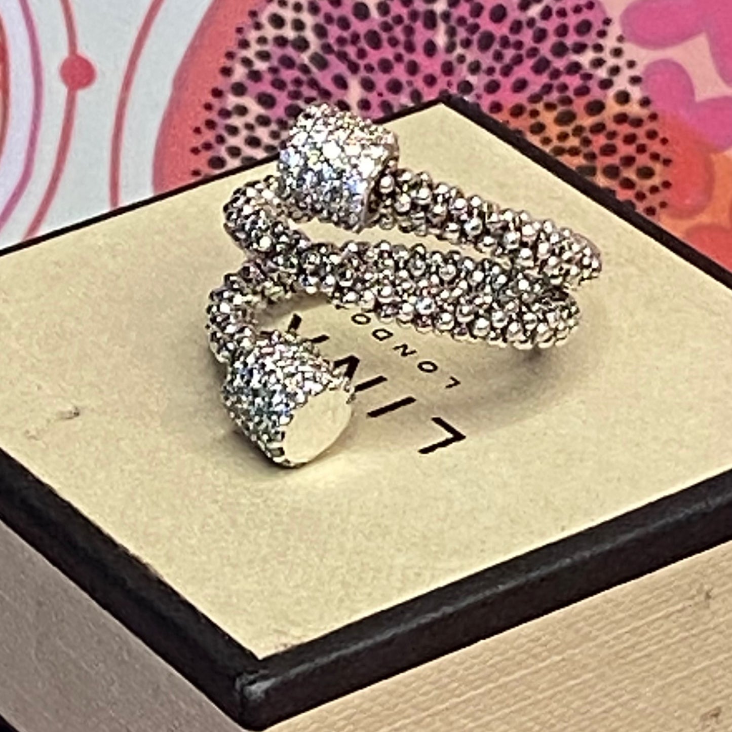 Links of London Sterling Silver Star Dust Wrap Ring with Round barrels covered with Sparkly stones.