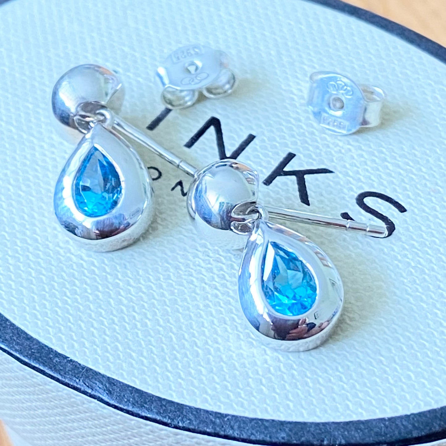 Links of London Sterling Silver Tear Drop Earrings with a Blue Topaz Tear Drop Stone with butterfly backs