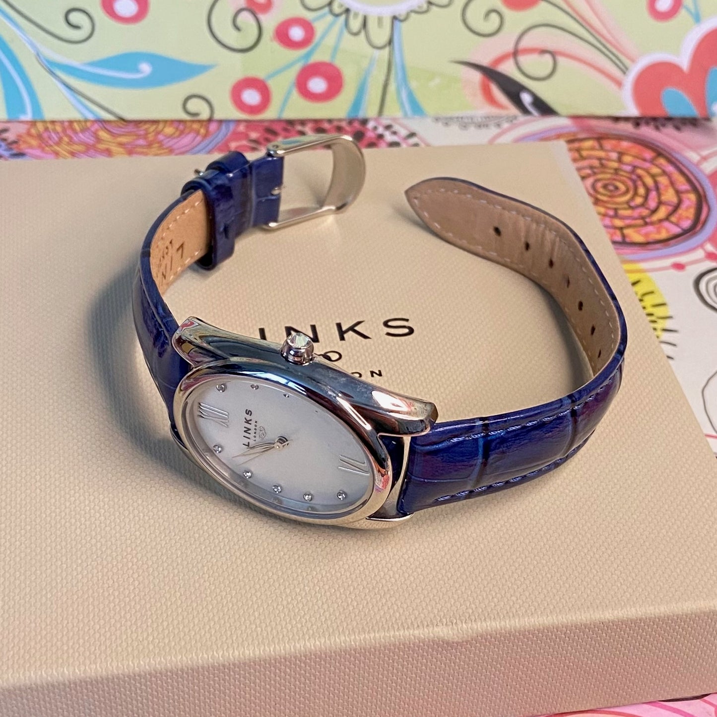 Rare Links of London Driver Ellipse Watch with Mother of pearl face, 10 Sapphire Crystals a Blue Real Leather Strap.