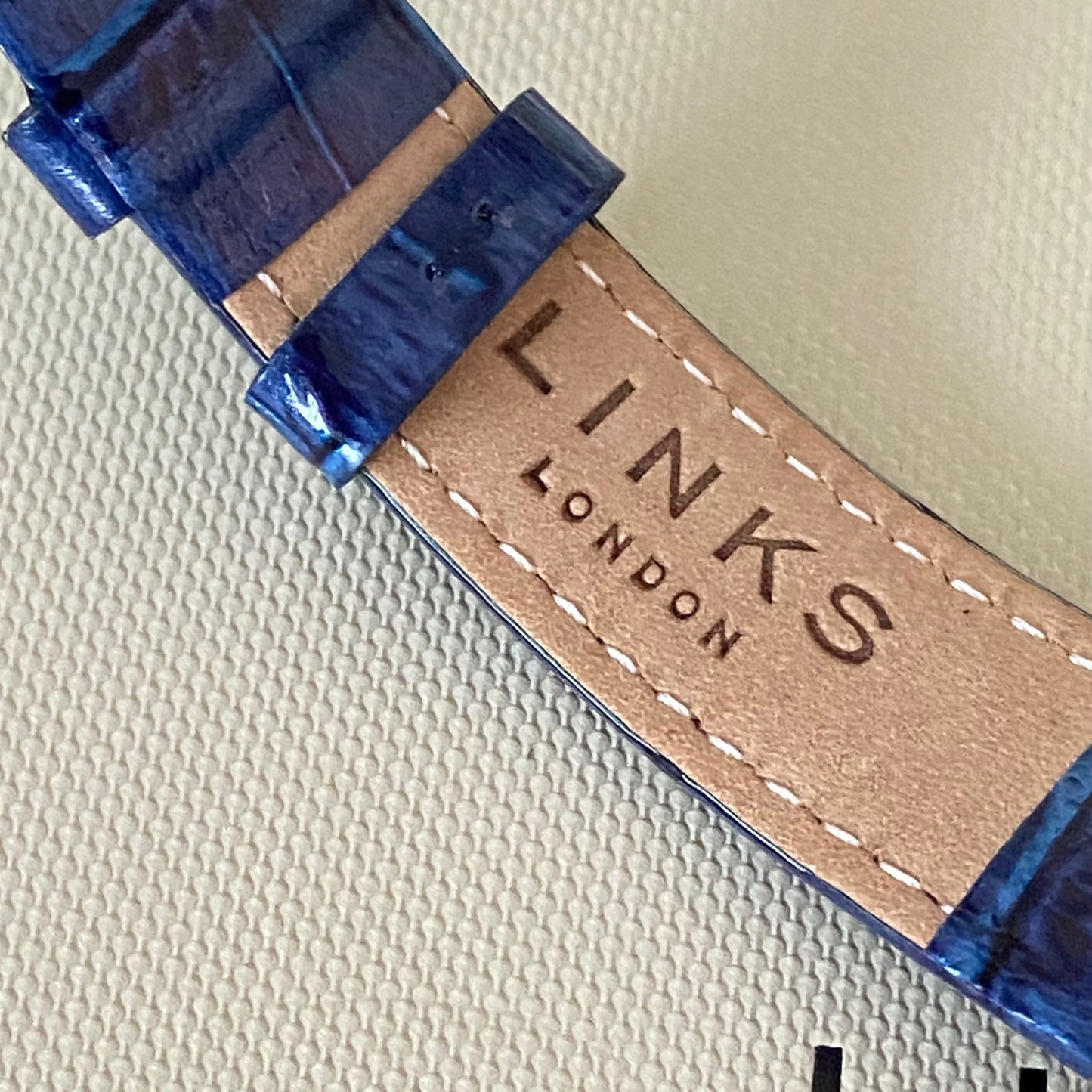 Rare Links of London Driver Ellipse Watch with Mother of pearl face, 10 Sapphire Crystals a Blue Real Leather Strap.
