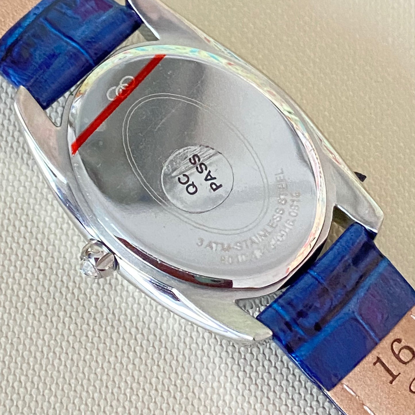 Rare Links of London Driver Ellipse Watch with Mother of pearl face, 10 Sapphire Crystals a Blue Real Leather Strap.