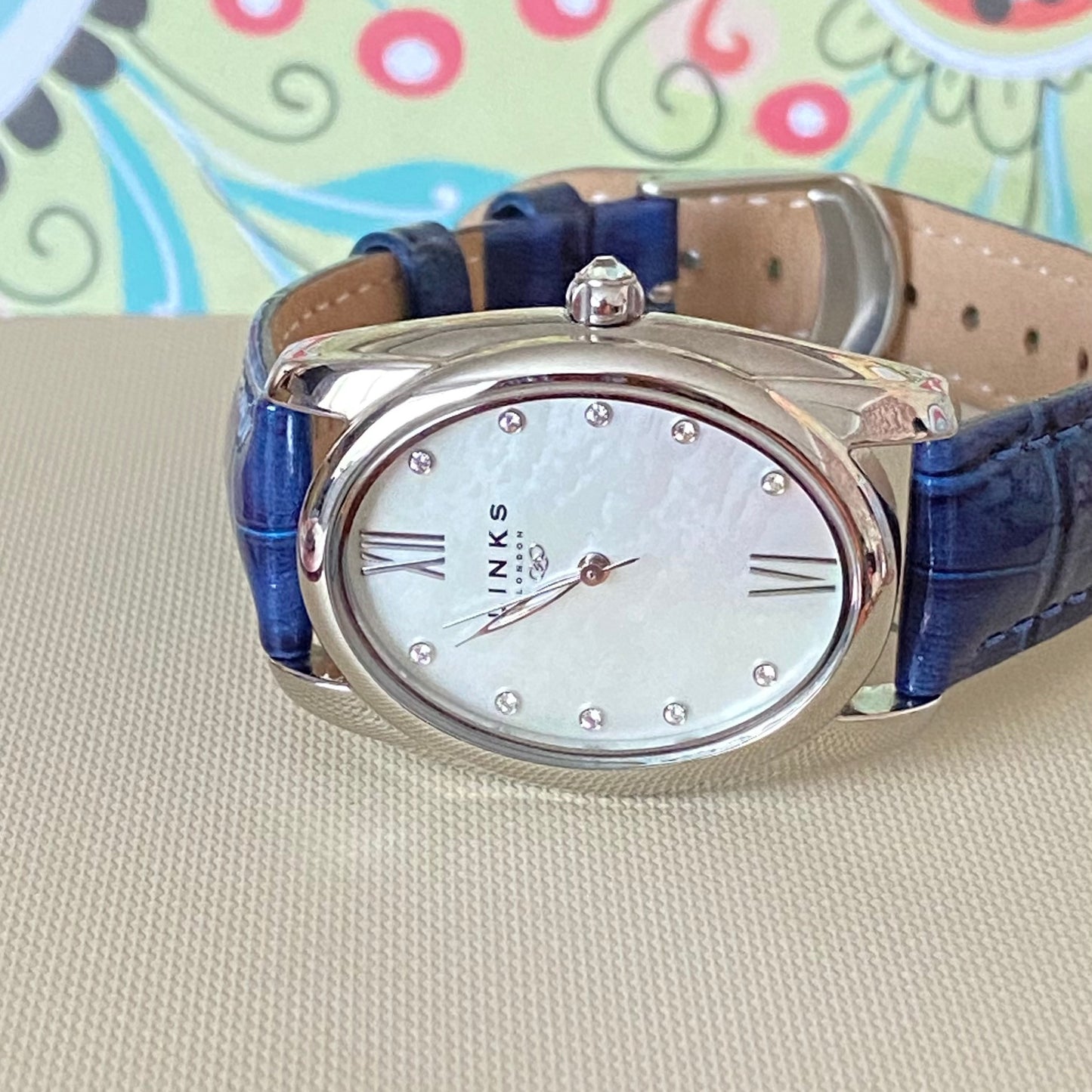 Rare Links of London Driver Ellipse Watch with Mother of pearl face, 10 Sapphire Crystals a Blue Real Leather Strap.