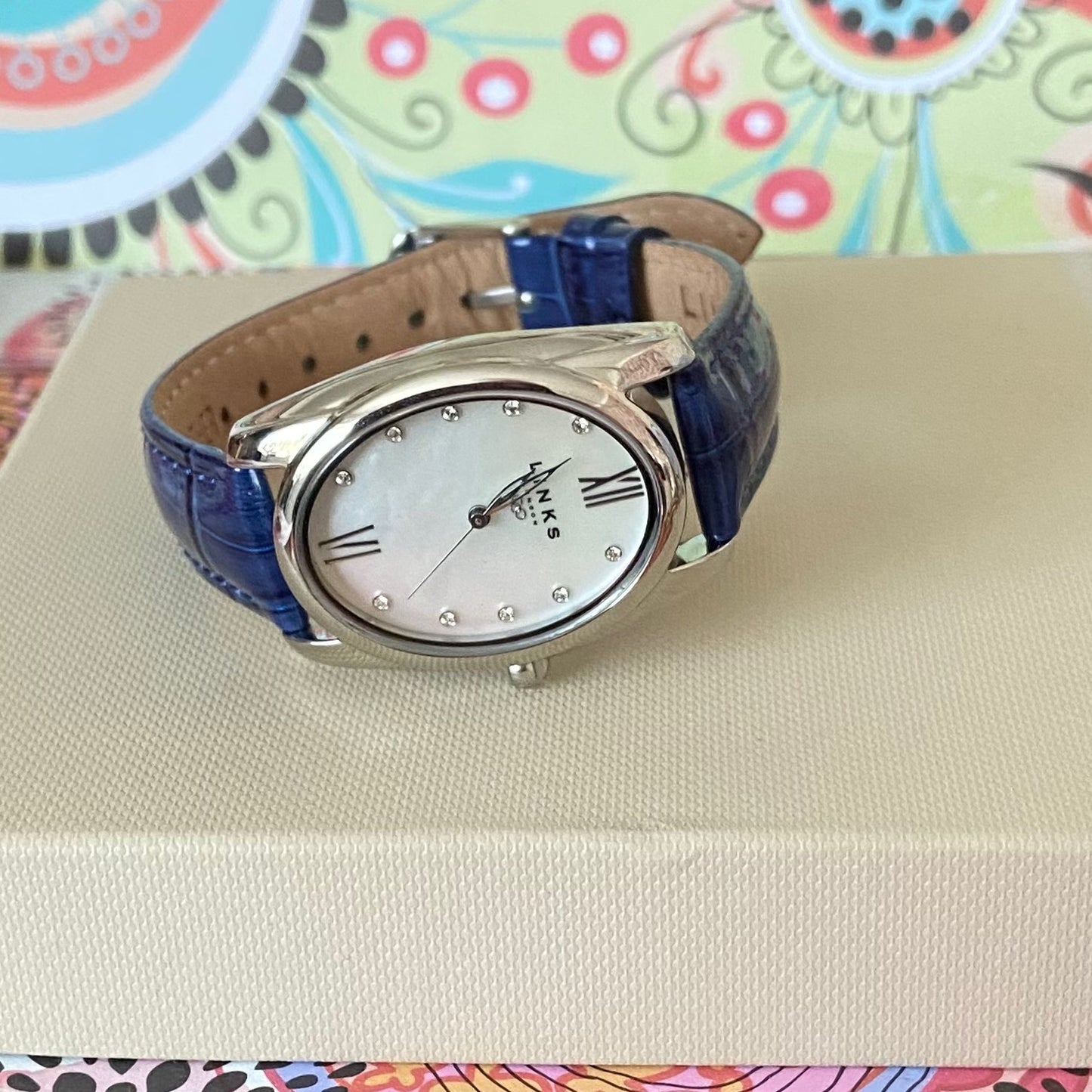 Rare Links of London Driver Ellipse Watch with Mother of pearl face, 10 Sapphire Crystals a Blue Real Leather Strap.