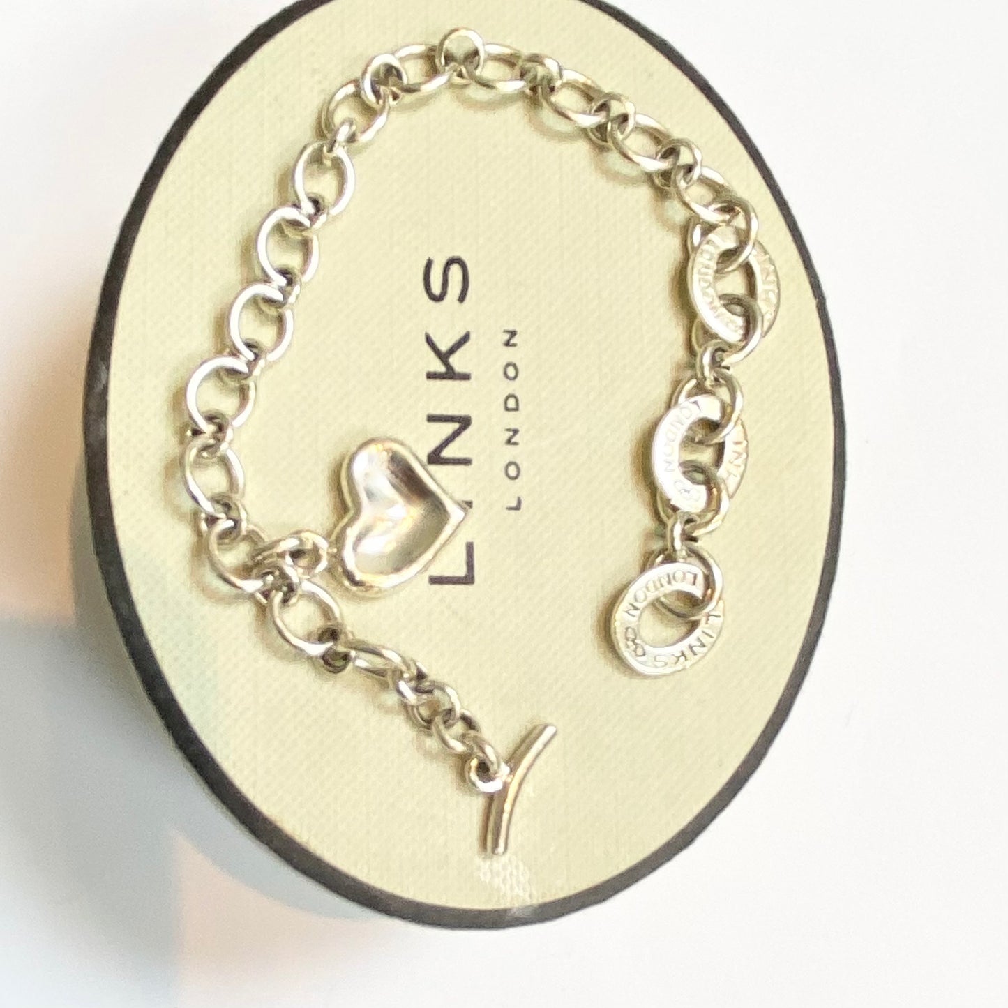 Pre Loved Links of London Silver Bracelet with 3 Links of London Links, Heart charm and T Bar Clasp.