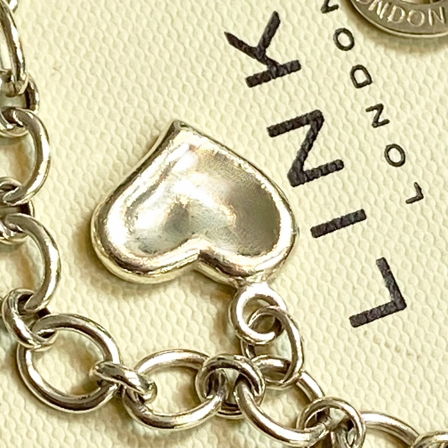 Pre Loved Links of London Silver Bracelet with 3 Links of London Links, Heart charm and T Bar Clasp.