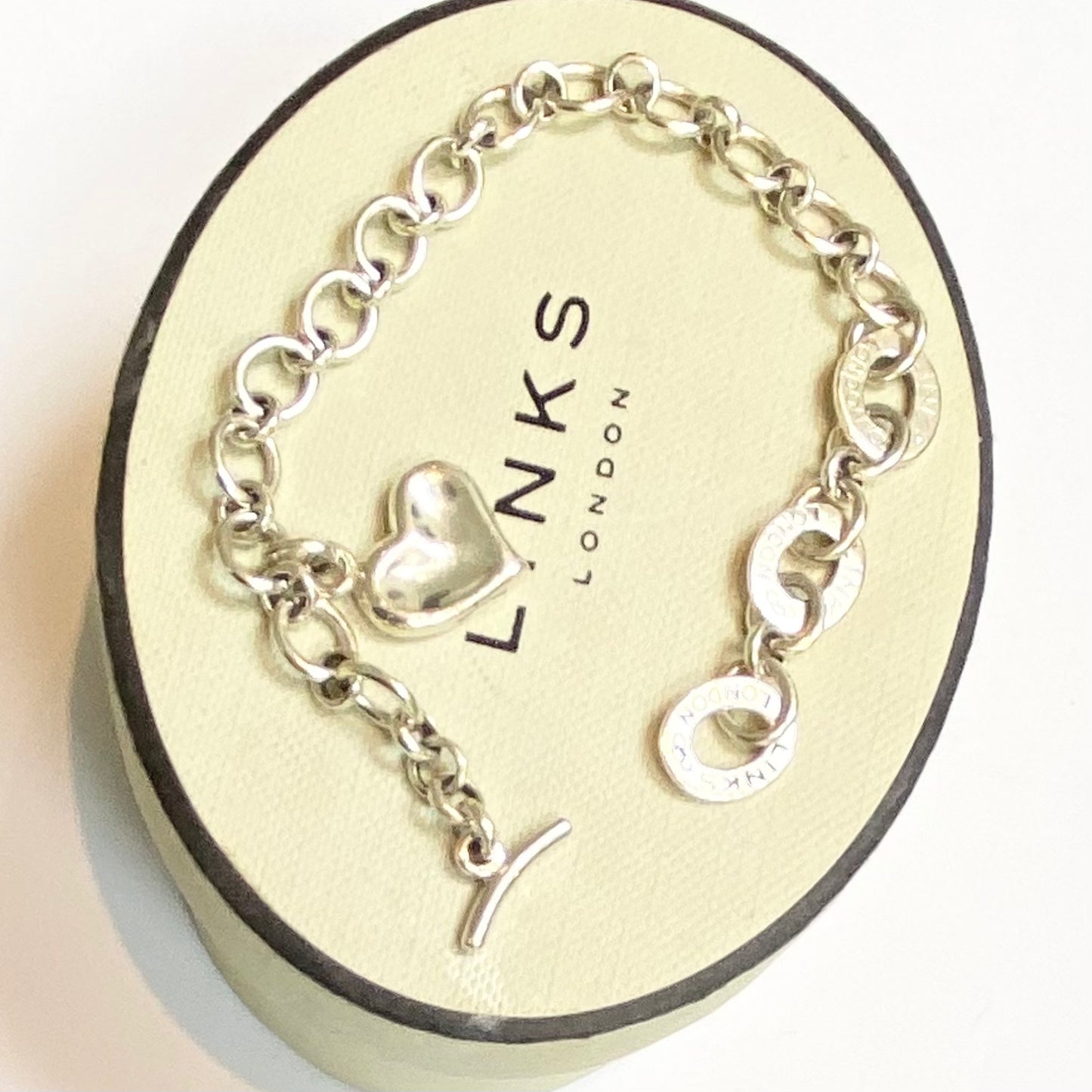 Pre Loved Links of London Silver Bracelet with 3 Links of London Links, Heart charm and T Bar Clasp.