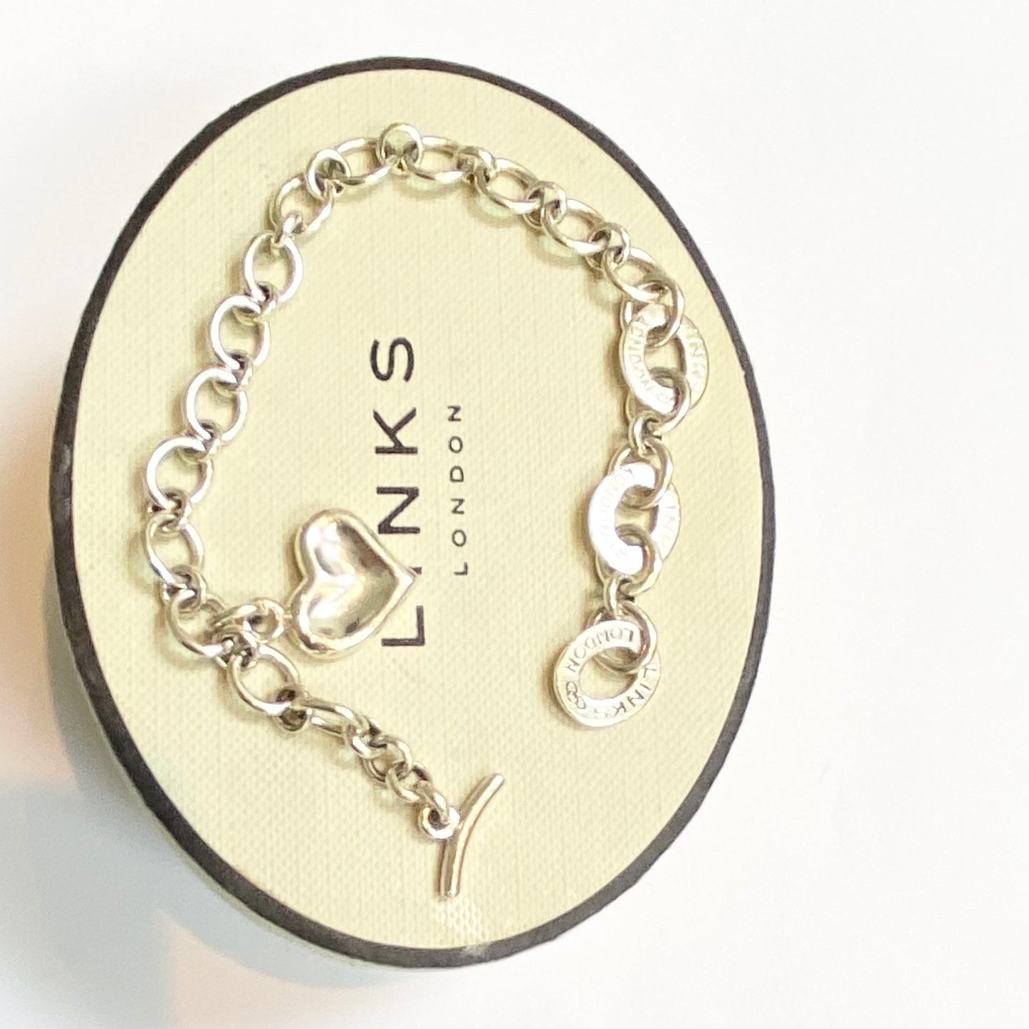 Pre Loved Links of London Silver Bracelet with 3 Links of London Links, Heart charm and T Bar Clasp.