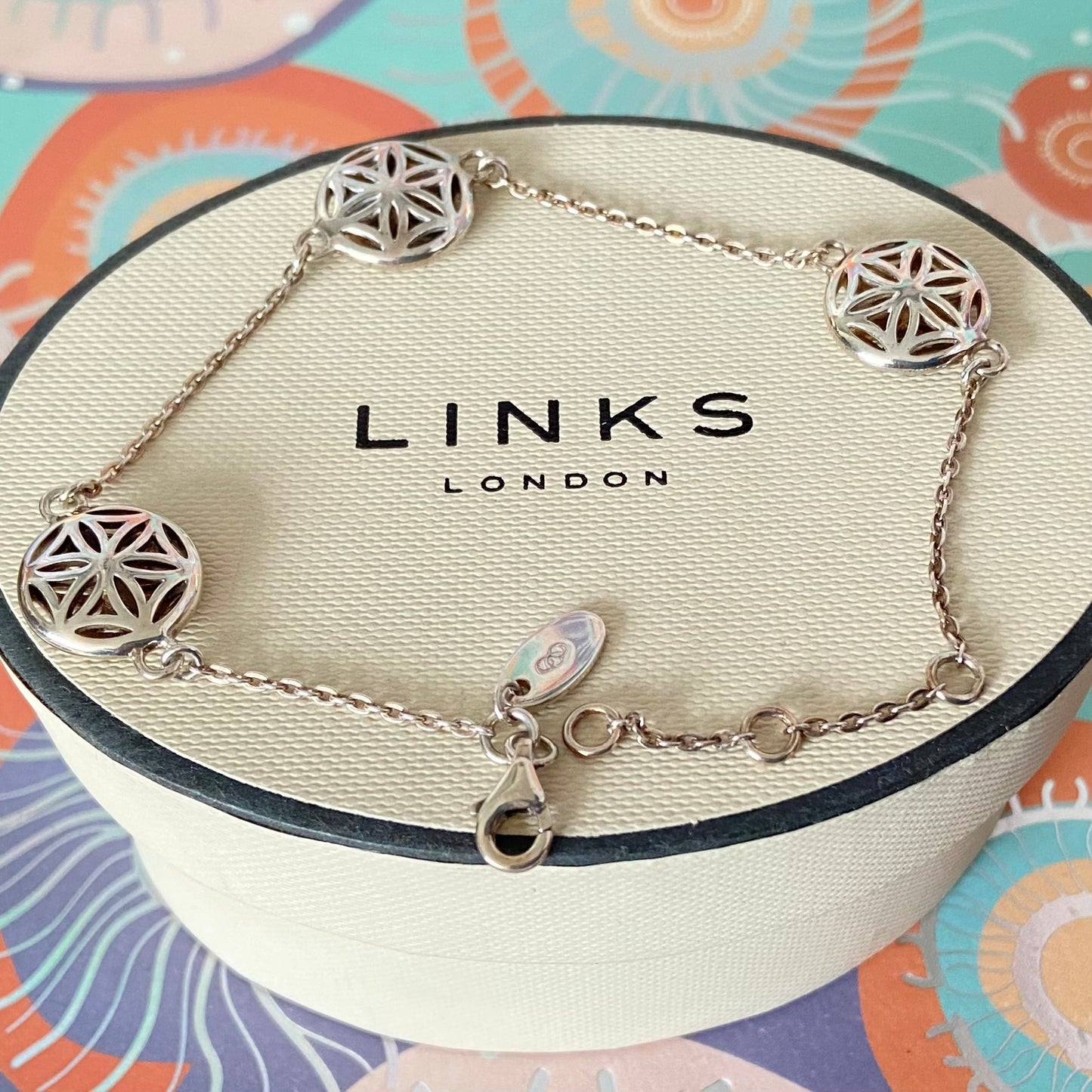 Links of London Bracelet featuring 3 disks with the Flower of Life Design. 20cm adjustable