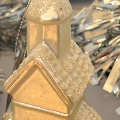 shimmering  champagne glass church Christmas ornament accented with sparkling glitter snow details