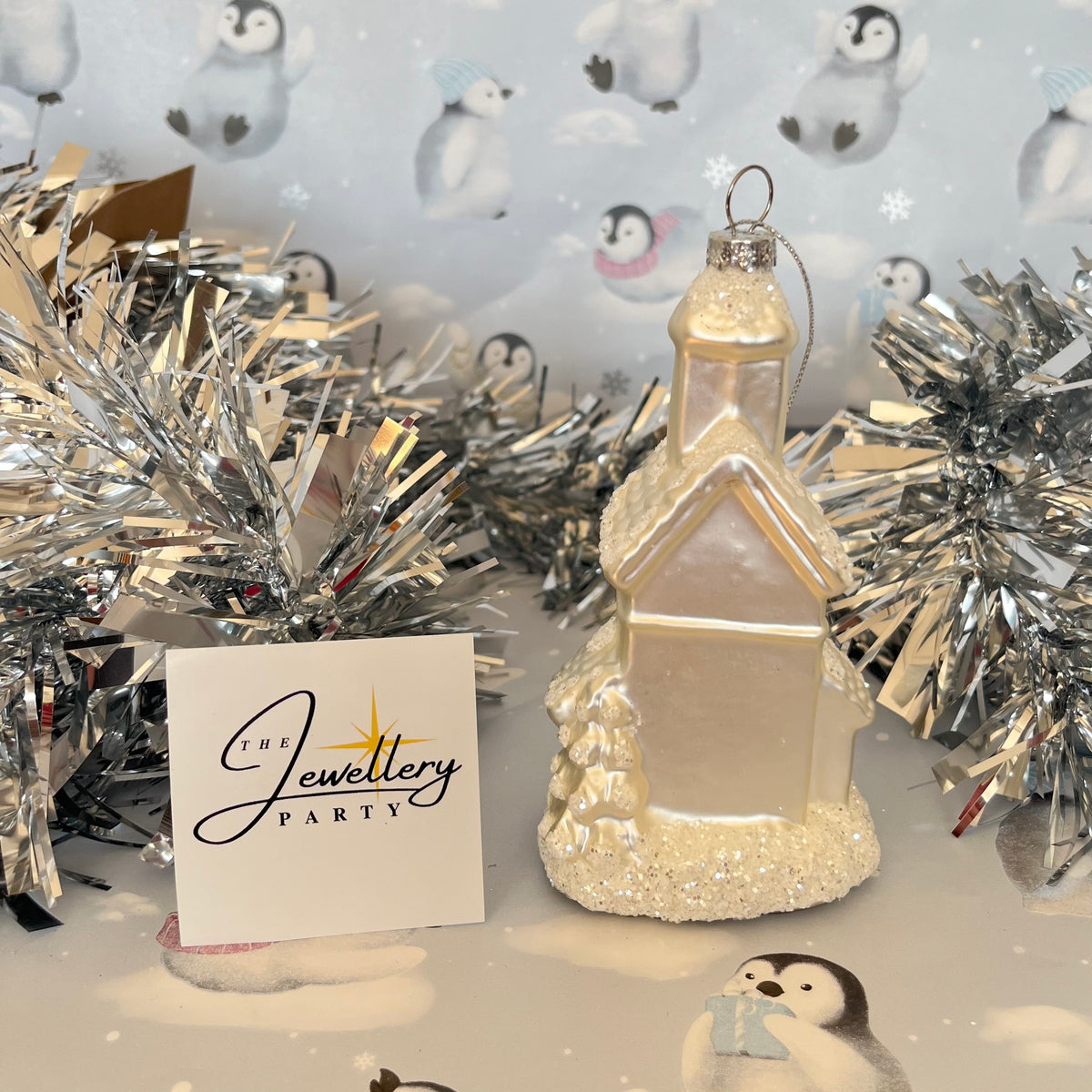 shimmering  champagne glass church Christmas ornament accented with sparkling glitter snow details