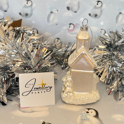 shimmering  champagne glass church Christmas ornament accented with sparkling glitter snow details