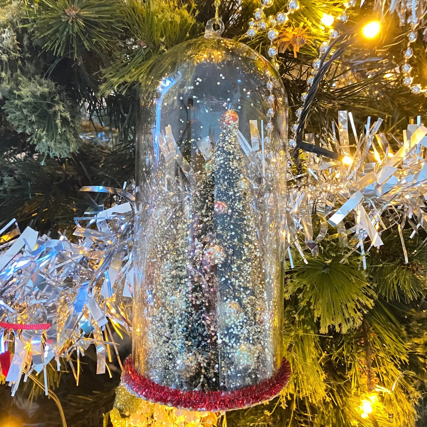 Christmas Tree Decoration in a Glass Dome. Beautiful Holiday Decoration