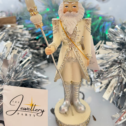Gisela Graham cream and silver nutcracker figurine holding a staff.