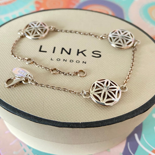 Links of London Bracelet featuring 3 disks with the Flower of Life Design. 20cm adjustable