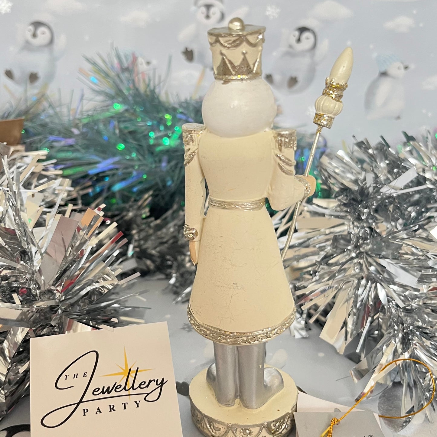 Gisela Graham cream and silver nutcracker figurine holding a staff.