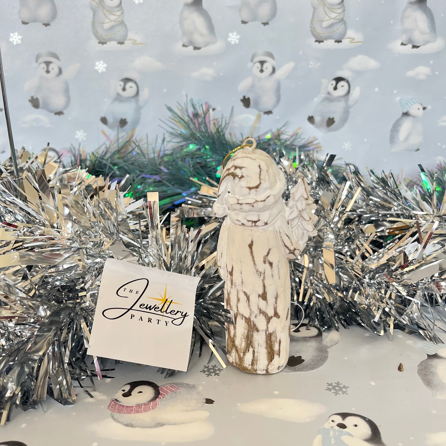 Natural  Distressed Effect Carved Santa hanging ornament holding a Christmas tree