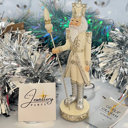Gisela Graham cream and silver nutcracker figurine holding a staff.
