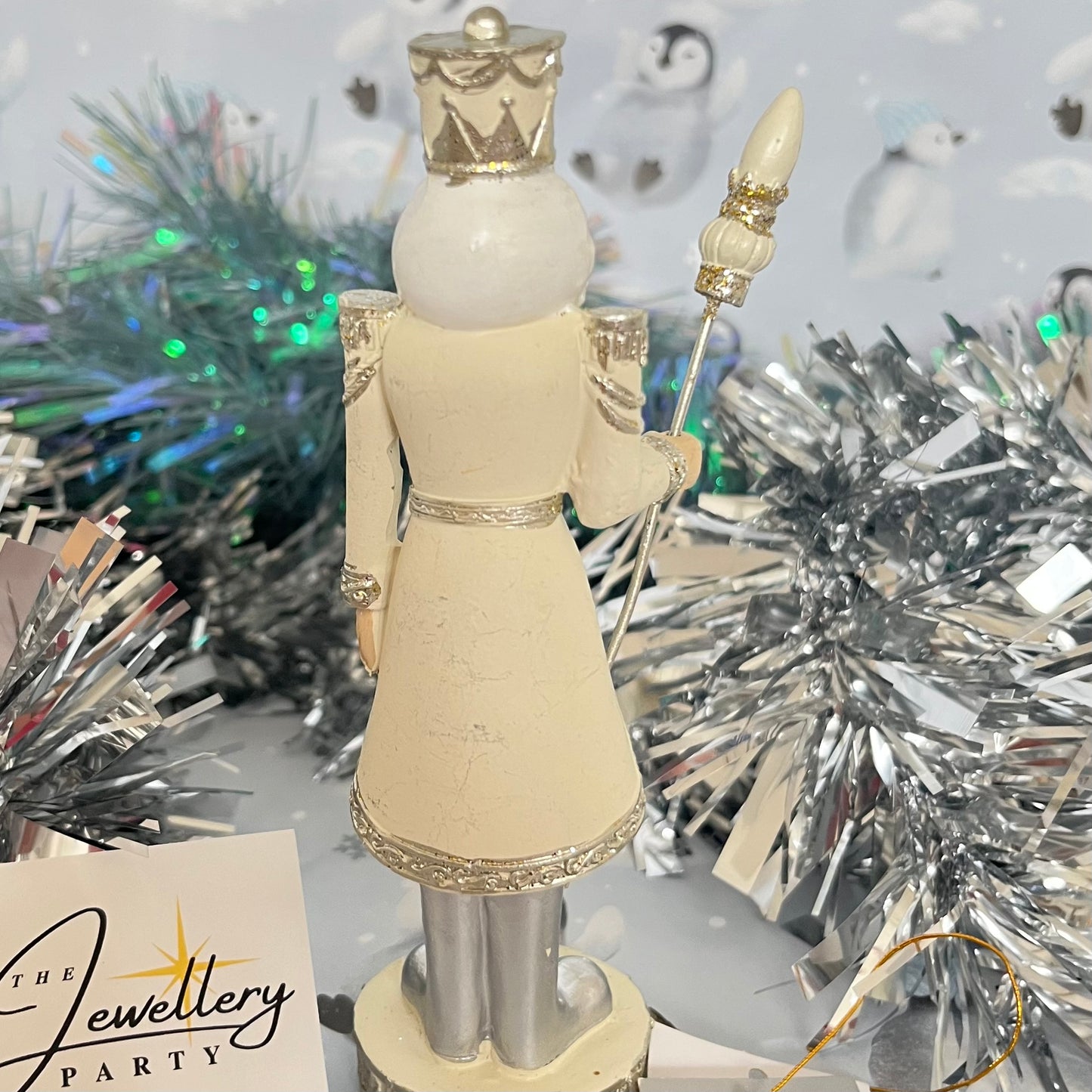 Gisela Graham cream and silver nutcracker figurine holding a staff.