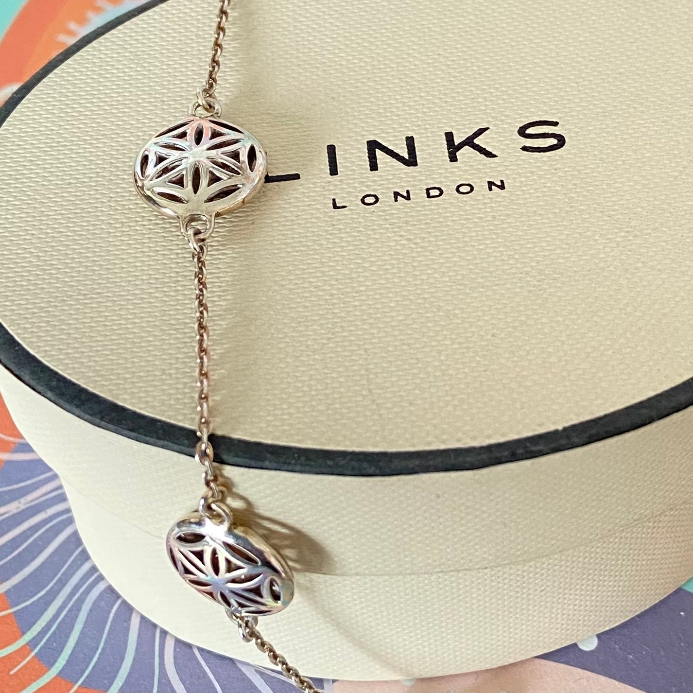 Links of London Bracelet featuring 3 disks with the Flower of Life Design. 20cm adjustable