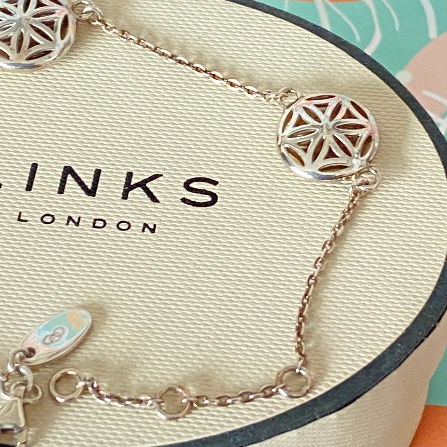 Links of London Bracelet featuring 3 disks with the Flower of Life Design. 20cm adjustable