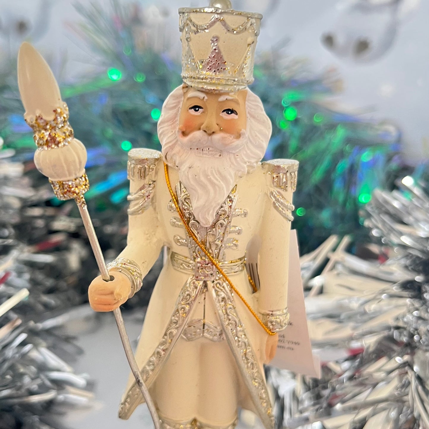 Gisela Graham cream and silver nutcracker figurine holding a staff.
