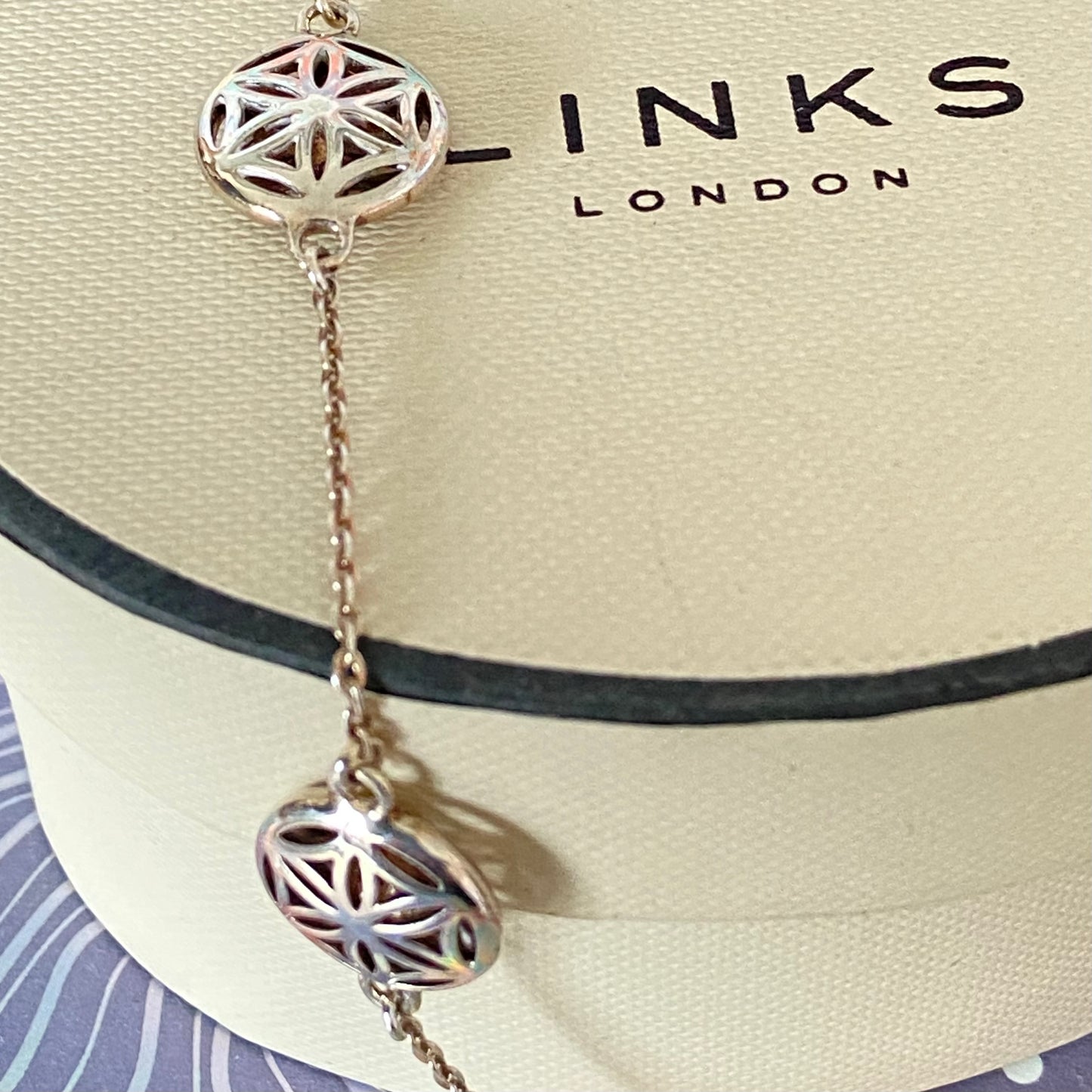 Links of London Bracelet featuring 3 disks with the Flower of Life Design. 20cm adjustable