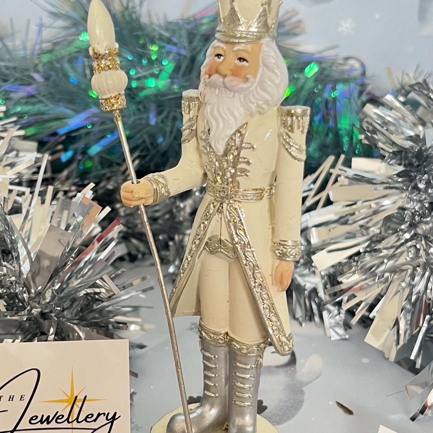 Gisela Graham cream and silver nutcracker figurine holding a staff.