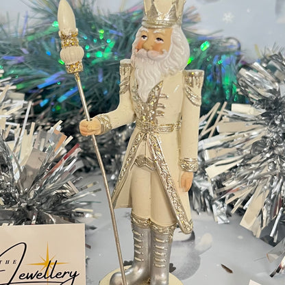 Gisela Graham cream and silver nutcracker figurine holding a staff.