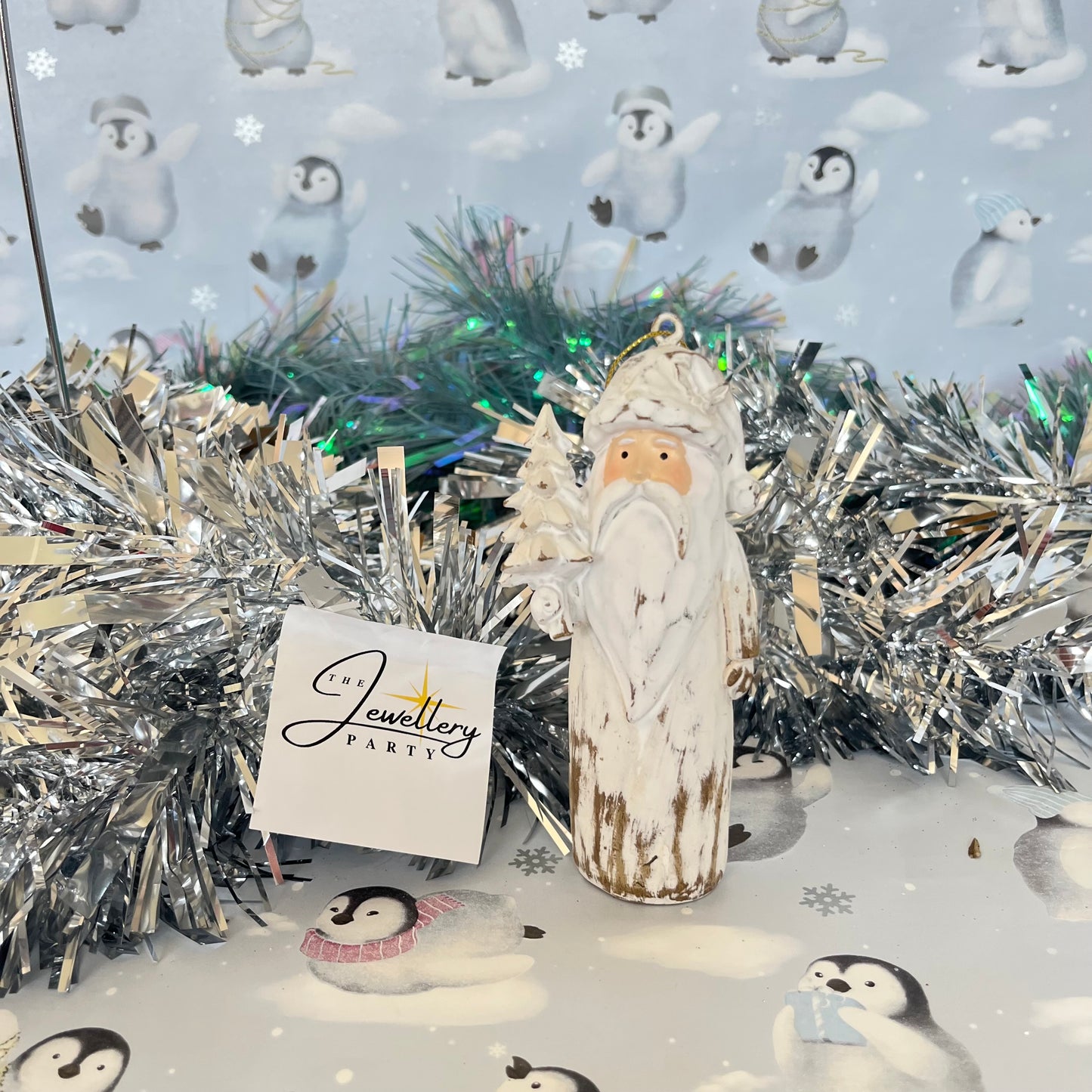 Natural  Distressed Effect Carved Santa hanging ornament holding a Christmas tree
