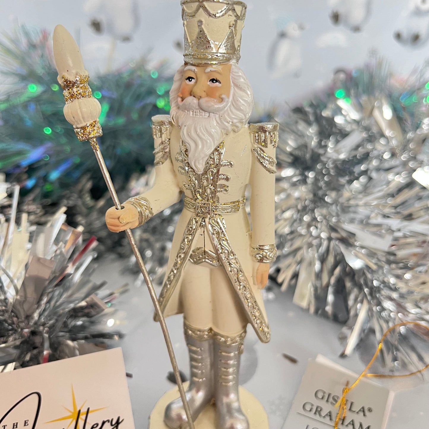 Gisela Graham cream and silver nutcracker figurine holding a staff.