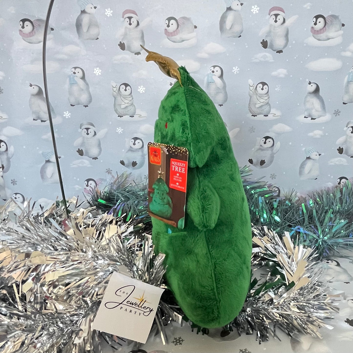 Festive green Squeezies Christmas tree plush toy