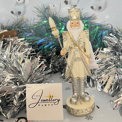Gisela Graham cream and silver nutcracker figurine holding a staff.