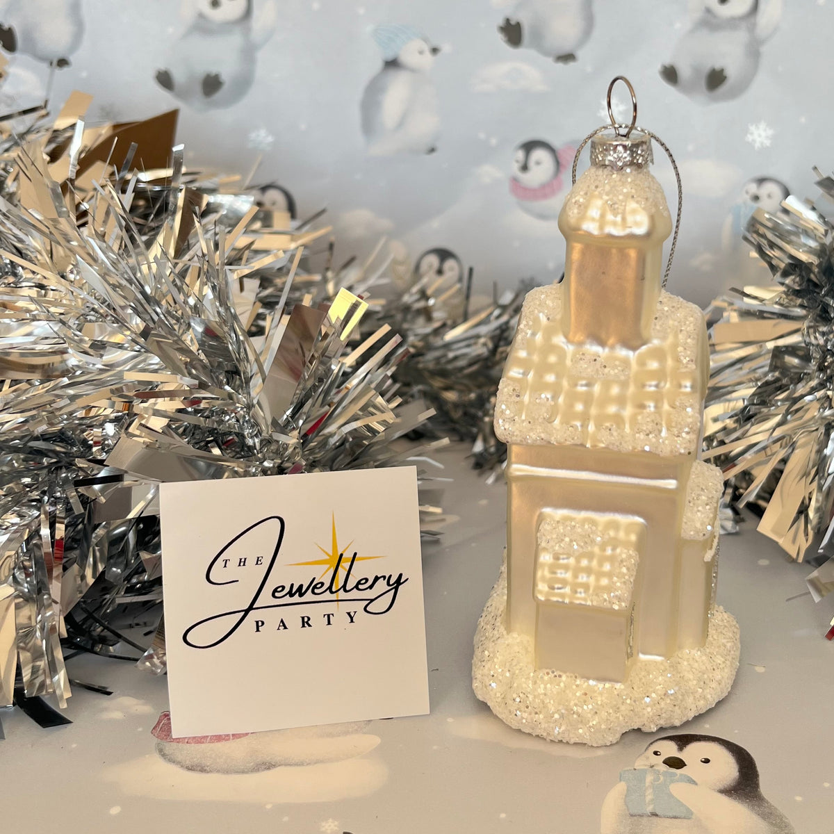 shimmering  champagne glass church Christmas ornament accented with sparkling glitter snow details