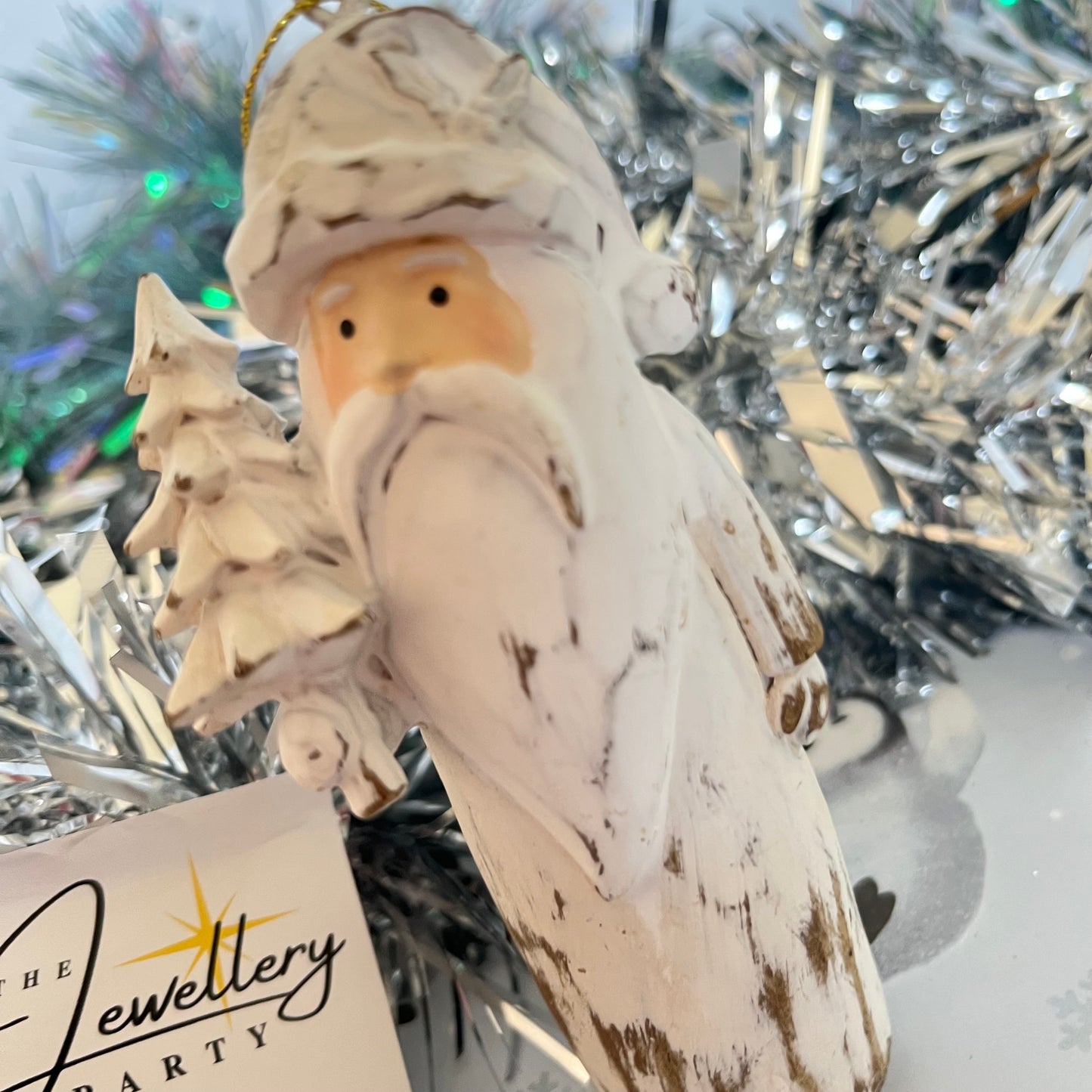 Natural  Distressed Effect Carved Santa hanging ornament holding a Christmas tree
