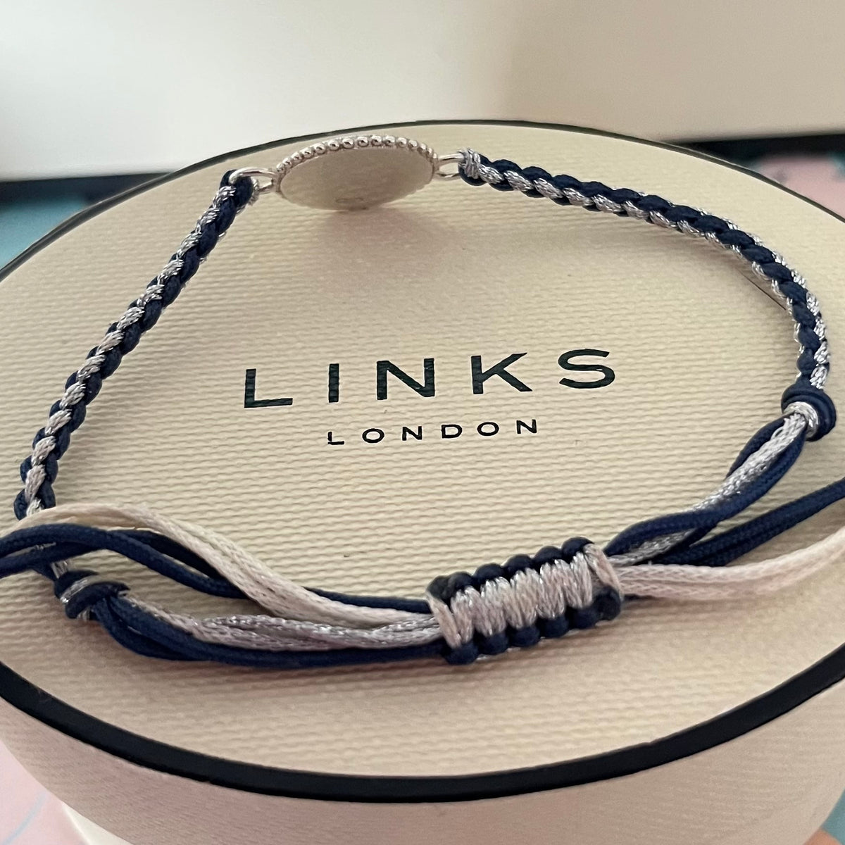 Links of London Sterling Silver Ascot Bracelet with a Navy and Silver Cord.