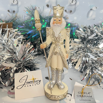 Gisela Graham cream and silver nutcracker figurine holding a staff.
