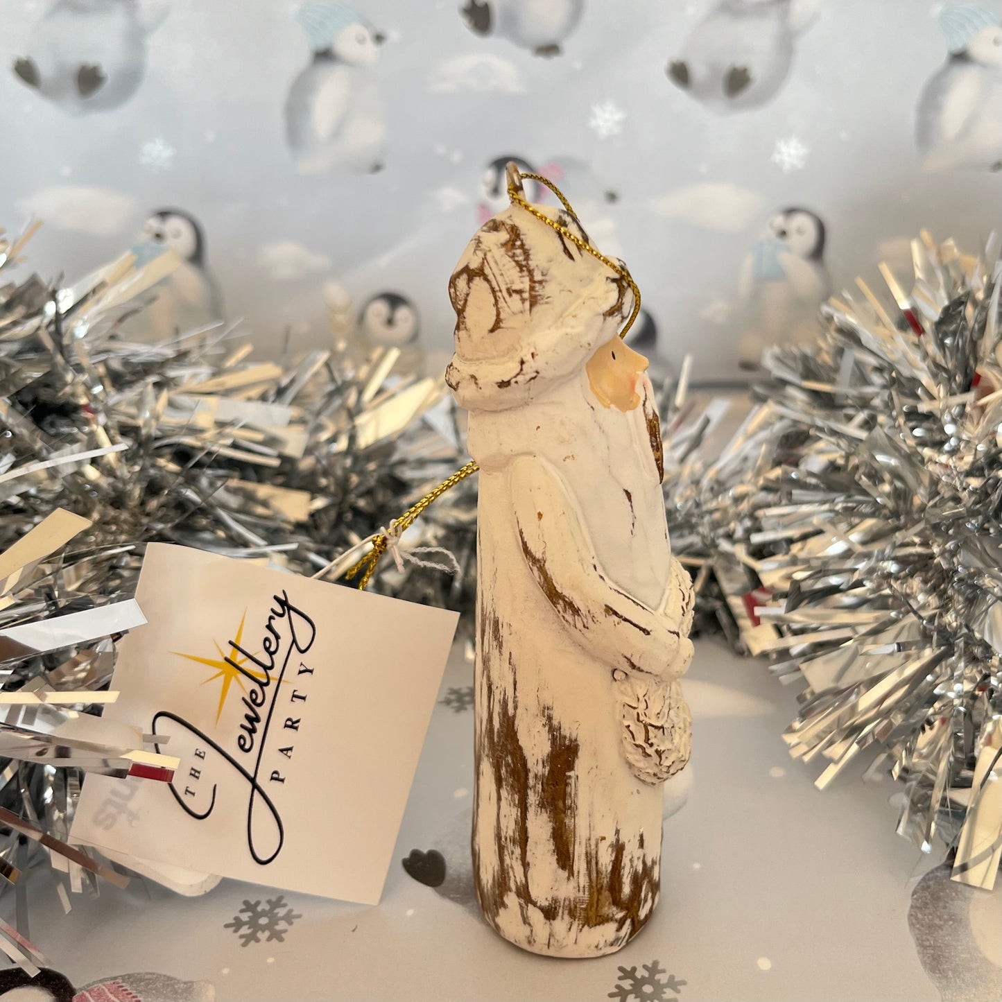Natural Distressed Effect Carved Santa hanging ornament holding a festive wreath