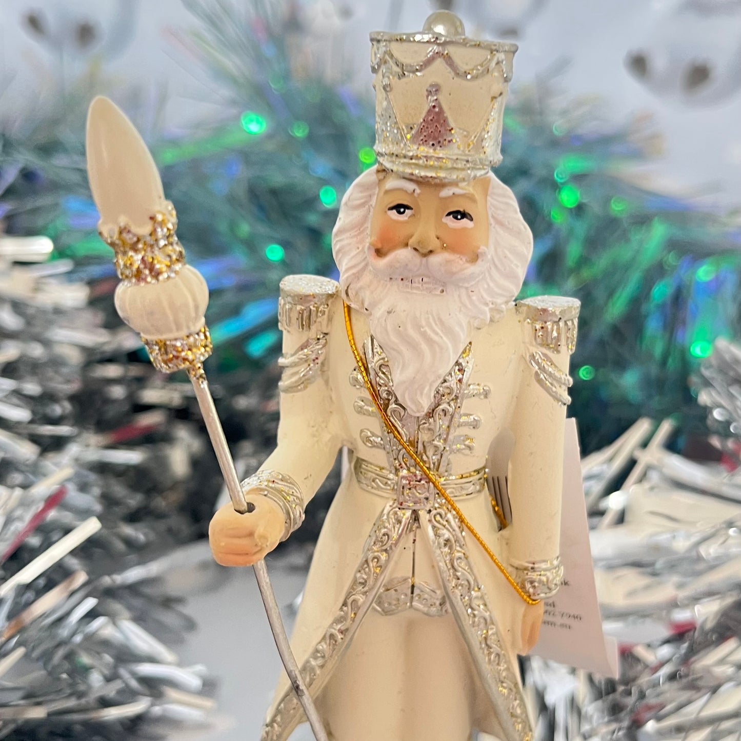 Gisela Graham cream and silver nutcracker figurine holding a staff.
