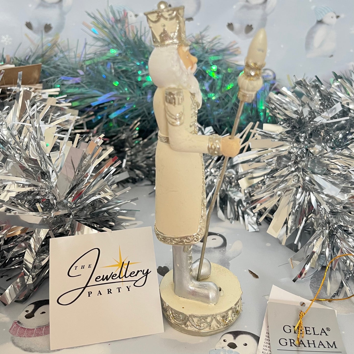 Gisela Graham cream and silver nutcracker figurine holding a staff.