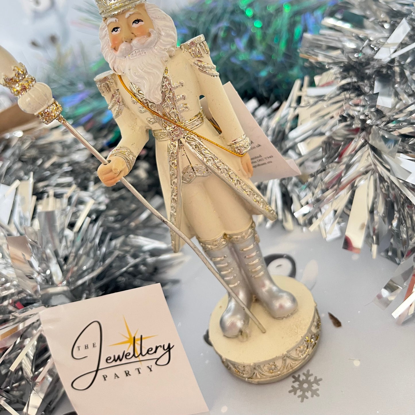 Gisela Graham cream and silver nutcracker figurine holding a staff.
