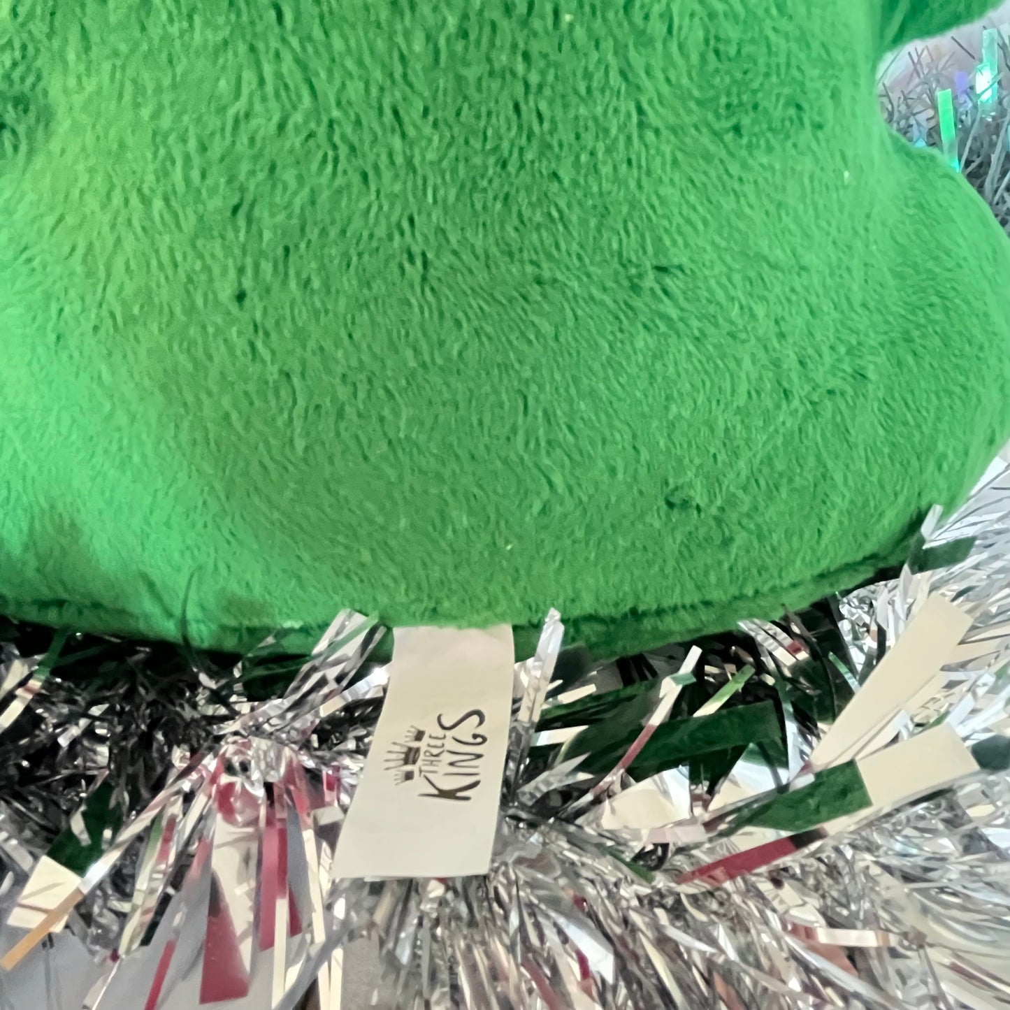 Festive green Squeezies Christmas tree plush toy