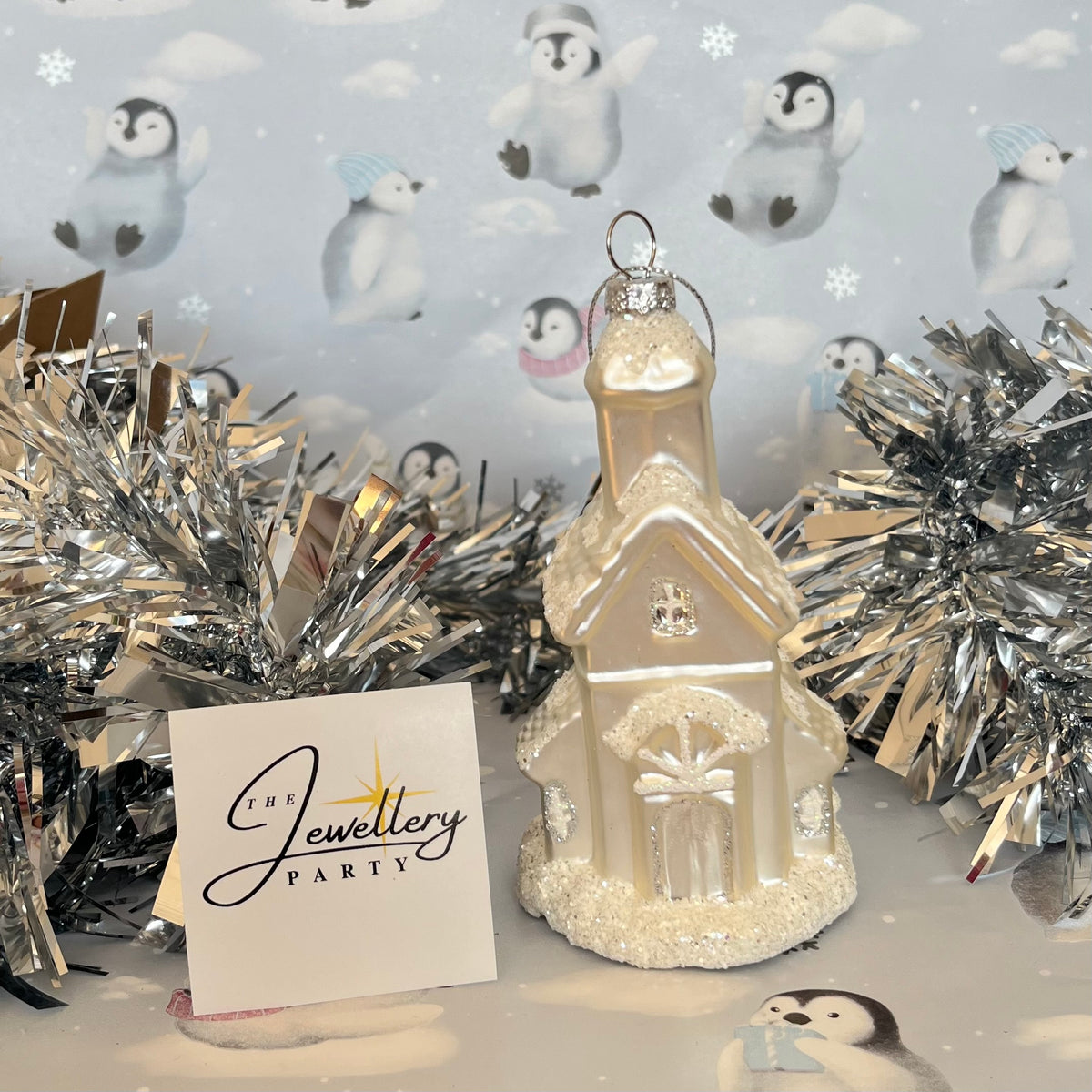 shimmering  champagne glass church Christmas ornament accented with sparkling glitter snow details