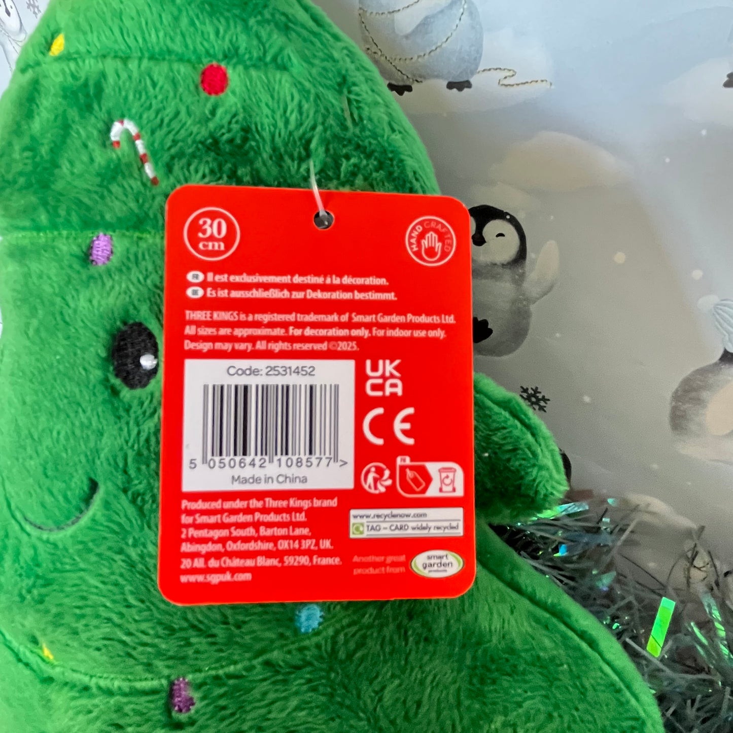 Festive green Squeezies Christmas tree plush toy