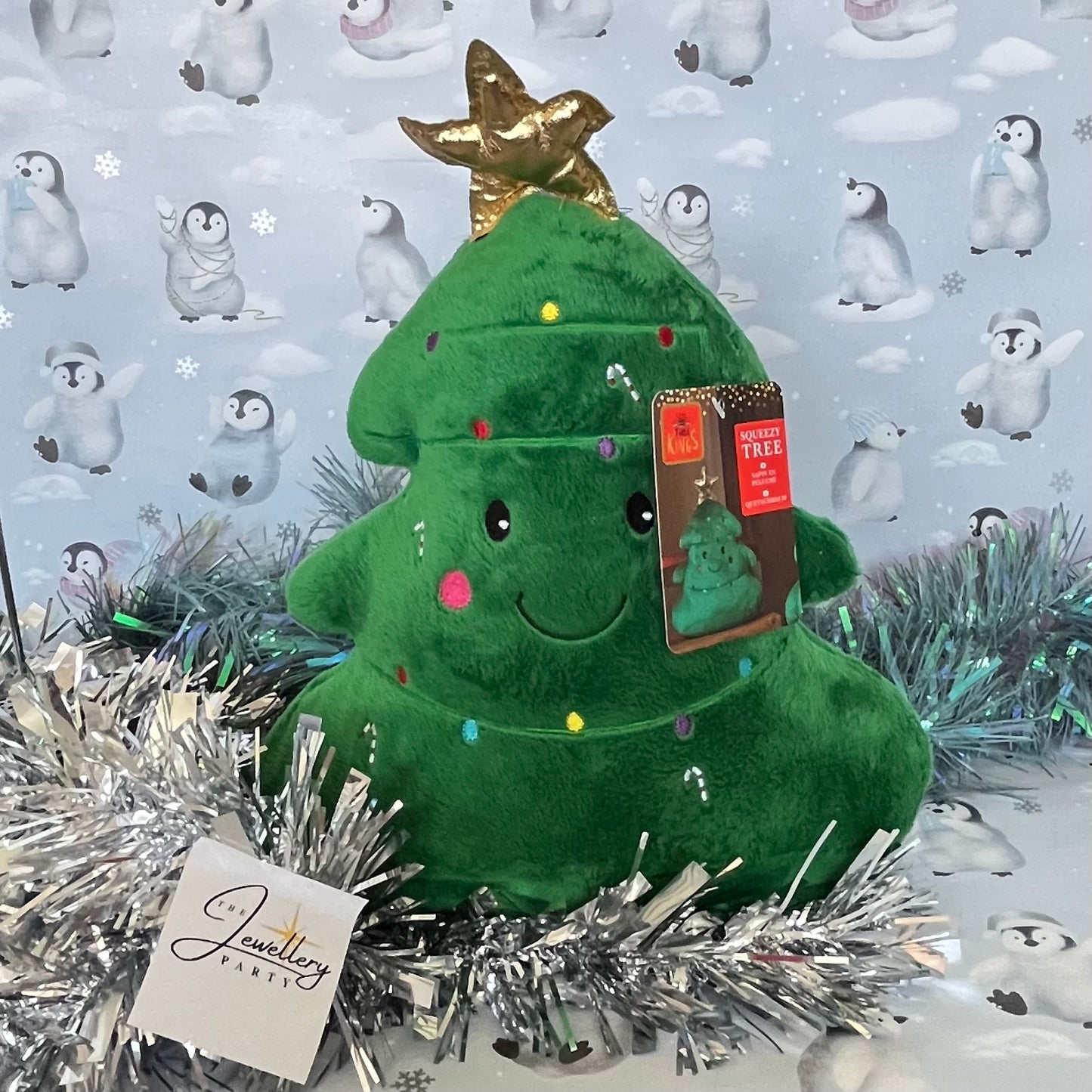 Festive green Squeezies Christmas tree plush toy